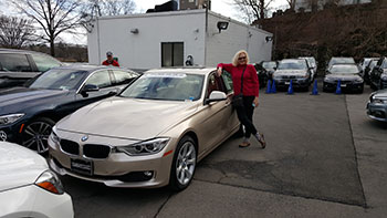 Cindy Herrmann with her prized BMW